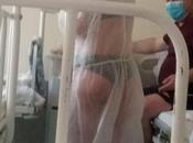 Nurse Suspended Wearing Nothing Bikini Underneath Transparent Gown